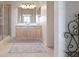 Bathroom featuring walk-in shower, vanity, and attractive decor at 3456 Parkridge Cir # 33-105, Sarasota, FL 34243