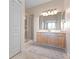 Well-lit bathroom with walk-in shower and vanity with sink at 3456 Parkridge Cir # 33-105, Sarasota, FL 34243