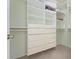 Custom closet with built-in drawers and ample shelving at 3456 Parkridge Cir # 33-105, Sarasota, FL 34243