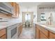 Kitchen with a view to the breakfast nook featuring white appliances and neutral wall colors at 3456 Parkridge Cir # 33-105, Sarasota, FL 34243