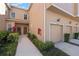 Charming townhome with a well-maintained lawn and a pathway leading to the front door and attached garage at 3456 Parkridge Cir # 33-105, Sarasota, FL 34243