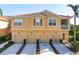 Charming multi-Gathering home featuring multiple garages and a tile roof, exuding curb appeal and functionality at 3456 Parkridge Cir # 33-105, Sarasota, FL 34243