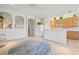 Bright open floor plan showcases the kitchen and living room with ceramic tile and arched doorways at 3456 Parkridge Cir # 33-105, Sarasota, FL 34243