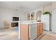 Open-concept kitchen with breakfast bar and stainless-steel appliances, ideal for casual dining and entertaining at 3456 Parkridge Cir # 33-105, Sarasota, FL 34243
