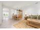 Bright living area with tiled floors, and a dining set, perfect for comfortable living and entertaining guests at 3456 Parkridge Cir # 33-105, Sarasota, FL 34243