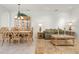 Bright living area with tiled floors, and a dining set, perfect for comfortable living and entertaining guests at 3456 Parkridge Cir # 33-105, Sarasota, FL 34243