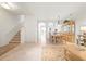 Bright living room with tiled floors, adjacent to a dining area, perfect for comfortable living and entertaining guests at 3456 Parkridge Cir # 33-105, Sarasota, FL 34243
