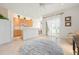 Bright open floor plan showcases the kitchen and living room with ceramic tile and view to the lake at 3456 Parkridge Cir # 33-105, Sarasota, FL 34243