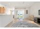 Bright living room boasts tile floors, neutral walls and sliding glass doors to a serene outdoor view at 3456 Parkridge Cir # 33-105, Sarasota, FL 34243
