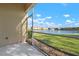 Screened patio overlooking a serene lake and a fountain at 3456 Parkridge Cir # 33-105, Sarasota, FL 34243