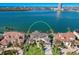 Aerial view of the home on a waterfront lot with a private dock on a sunny day at 348 W Royal Flamingo Dr, Sarasota, FL 34236