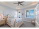 Bedroom showcasing serene water views, natural light and stylish furnishings at 348 W Royal Flamingo Dr, Sarasota, FL 34236