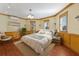 Bedroom featuring serene decor, with a large bed, natural light and wood trim at 348 W Royal Flamingo Dr, Sarasota, FL 34236