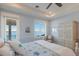 Bedroom showcasing serene water views, natural light and stylish furnishings at 348 W Royal Flamingo Dr, Sarasota, FL 34236
