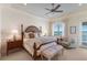 This well-lit bedroom features a king bed and stunning water views at 348 W Royal Flamingo Dr, Sarasota, FL 34236