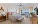 Serene main bedroom featuring water views, and a sitting area at 348 W Royal Flamingo Dr, Sarasota, FL 34236