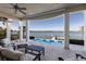 View of the covered outdoor lounge with a beautiful view of the bay and a plunge pool at 348 W Royal Flamingo Dr, Sarasota, FL 34236