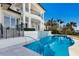 Home exterior featuring a pool, tile water feature, and covered outdoor spaces at 348 W Royal Flamingo Dr, Sarasota, FL 34236