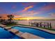 Inviting waterfront pool with dock and stunning sunset views of the city skyline at 348 W Royal Flamingo Dr, Sarasota, FL 34236
