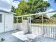 Backyard featuring a covered patio with a white picket fence at 3512 N 10Th St, Tampa, FL 33605