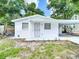 Exterior of a charming home featuring an ADT security system and colorful landscaping at 3512 N 10Th St, Tampa, FL 33605