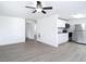 Open-concept living space featuring modern flooring and white wall paint at 3512 N 10Th St, Tampa, FL 33605