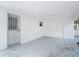 Covered patio with a security door and access to the backyard at 3512 N 10Th St, Tampa, FL 33605