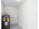 Utility room featuring an electric water heater against painted block walls at 3512 N 10Th St, Tampa, FL 33605