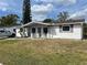 Charming single-story home with a well-maintained lawn and decorative accents at 3525 Emory Dr, Holiday, FL 34691