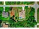 Overhead shot of home with a backyard pool surrounded by lush landscaping on a well maintained property at 3528 Monday Ter, North Port, FL 34286