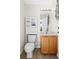 Bathroom has vanity, storage, and features decorative mirror and light fixture at 3528 Monday Ter, North Port, FL 34286