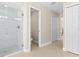Bright bathroom featuring a glass enclosed shower and tile flooring at 3528 Monday Ter, North Port, FL 34286