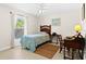 Well-lit bedroom with a window letting in plenty of natural light and a ceiling fan at 3528 Monday Ter, North Port, FL 34286