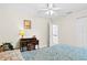 Bright bedroom featuring a ceiling fan and an office desk setup at 3528 Monday Ter, North Port, FL 34286