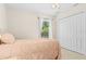 Bright bedroom with a window letting in plenty of natural light, perfect for relaxing at 3528 Monday Ter, North Port, FL 34286