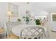 Open dining space adjacent to the kitchen, featuring an elegant chandelier and neutral decor at 3528 Monday Ter, North Port, FL 34286