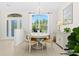 Dining area with a chandelier and a large window offering a view of the outdoors at 3528 Monday Ter, North Port, FL 34286
