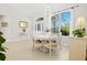 Bright dining area with a chandelier and large windows providing ample natural light at 3528 Monday Ter, North Port, FL 34286
