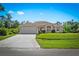 Beautiful home with a well-manicured lawn, spacious driveway, and attached two-car garage at 3528 Monday Ter, North Port, FL 34286