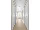 Hallway with tile flooring leading to the bathroom at 3528 Monday Ter, North Port, FL 34286