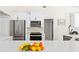 Modern kitchen features stainless appliances, and a well-lit countertop with an open layout at 3528 Monday Ter, North Port, FL 34286