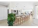 Spacious kitchen featuring a long breakfast bar with seating and seamless flow to the dining area at 3528 Monday Ter, North Port, FL 34286