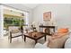 Comfortable living room offers views of the lanai, stylish furniture, and a relaxing atmosphere at 3528 Monday Ter, North Port, FL 34286