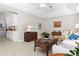 Inviting living room with comfortable seating, neutral tones, and adjacent to kitchen at 3528 Monday Ter, North Port, FL 34286