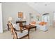 Bright living room features a vaulted ceiling, tile flooring, and stylish furniture arrangement at 3528 Monday Ter, North Port, FL 34286