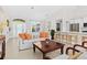 Bright living room with stylish furniture, tile flooring, and an open concept design at 3528 Monday Ter, North Port, FL 34286