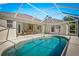 Relaxing screened-in pool area perfect for outdoor entertaining with comfortable seating at 3528 Monday Ter, North Port, FL 34286