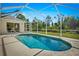 Beautiful backyard pool area with a screened enclosure and well maintained landscaping at 3528 Monday Ter, North Port, FL 34286