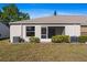 Rear exterior view of a home, with a well-kept lawn at 3605 60Th W St, Bradenton, FL 34209