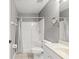 Practical bathroom with shower and curtain, featuring essential fixtures and neutral tones at 3605 60Th W St, Bradenton, FL 34209